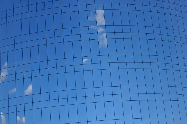 Reflections of clouds in a building. Tilted angle.