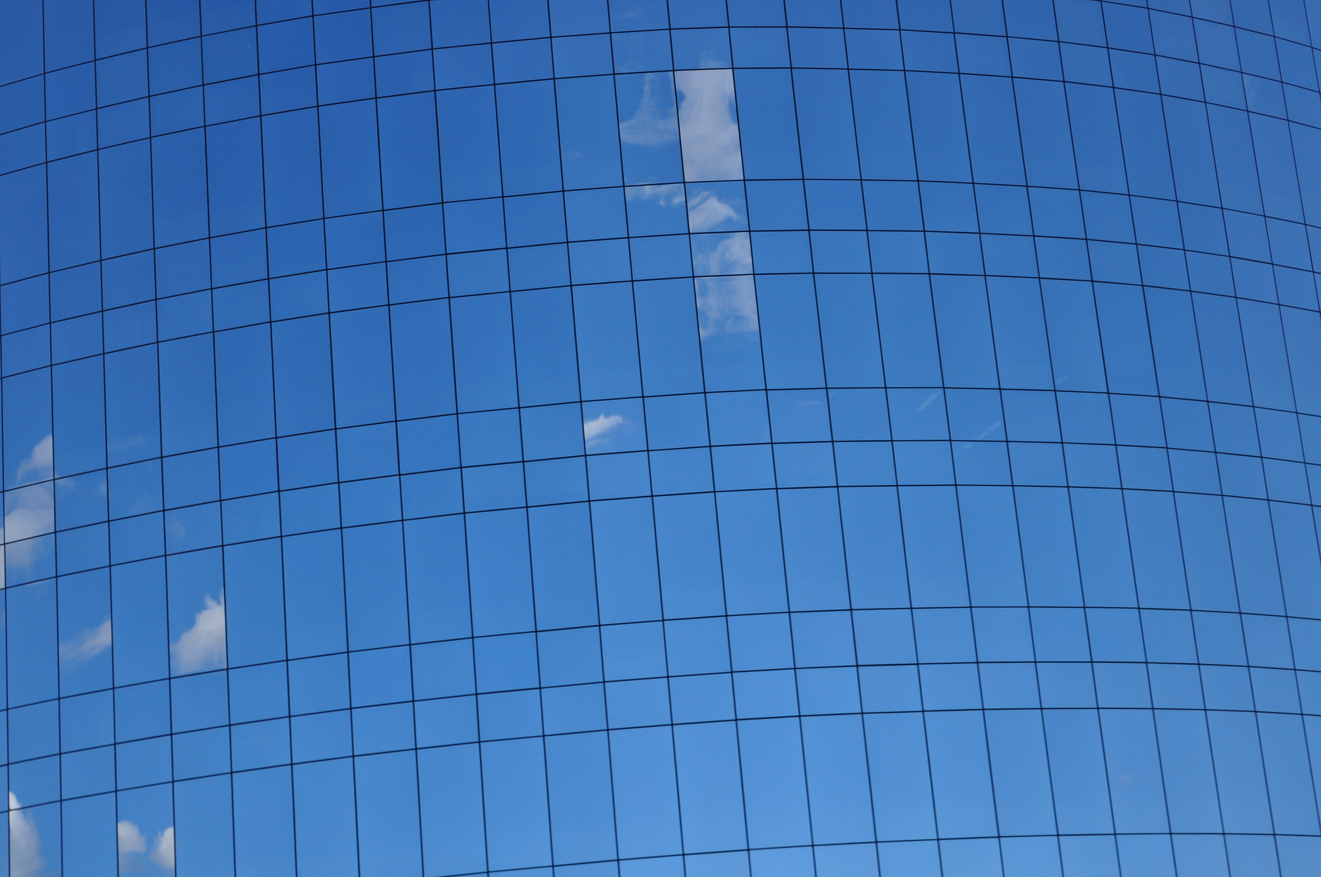 Reflections of clouds in a building. Tilted angle.