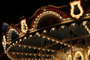 Lit carousel at night.