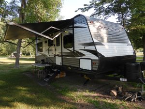 Camper parked at a camp site.