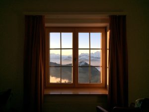 View on the Swiss Alps through a window from Rigi Kulm near Lucerne