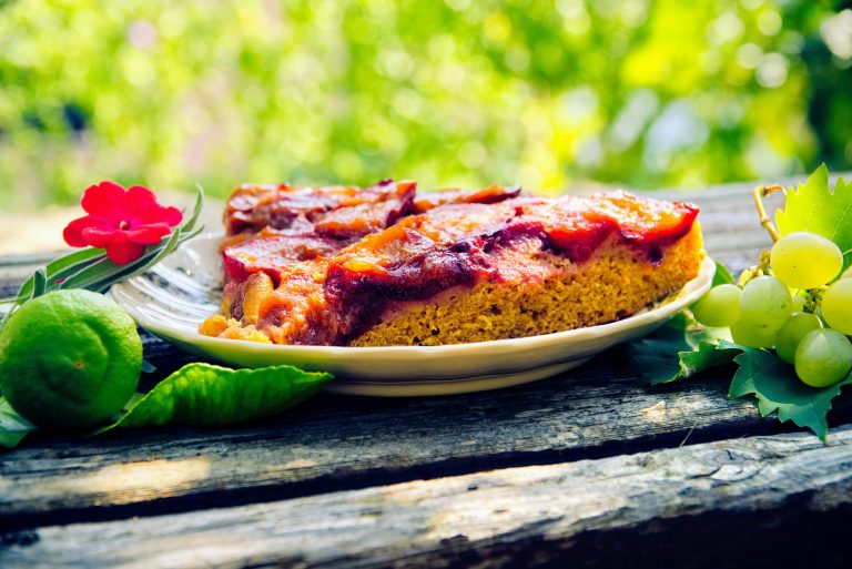 Fruit cake on a plate, outdoors.