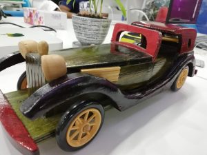Car carved in wood.
