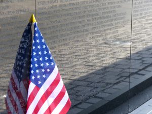 An American flag rests against the Vietnam War Memorial Wall in Washington, D.C.