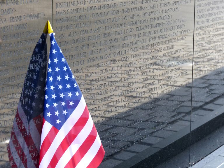 An American flag rests against the Vietnam War Memorial Wall in Washington, D.C.