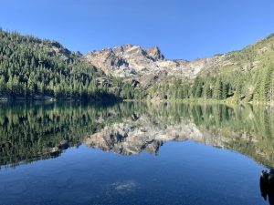 View larger photo: Secluded mountain lake in the Sierra Nevadas with the mountain reflection on the water