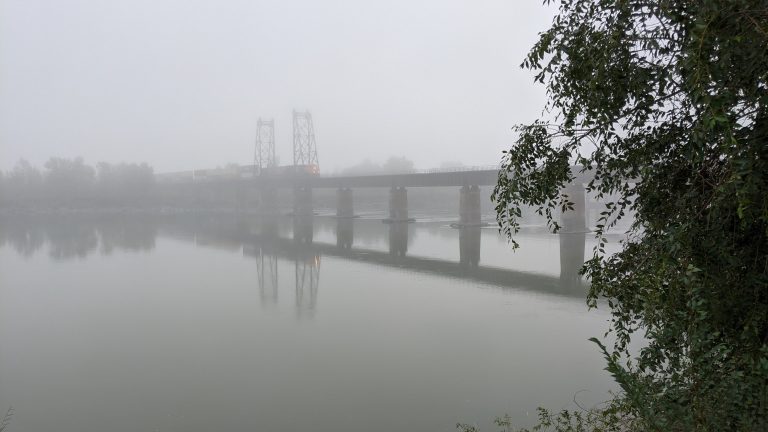 Extreme smoke from wildfires with a train going over a bridge in Kamloops British Columbia Canada (cough)