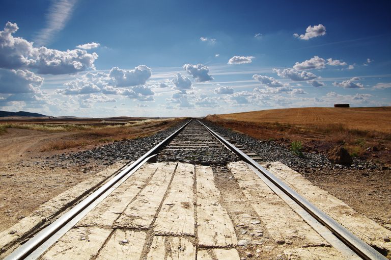 Railroad tracks disappearing into the distance of the Spanish countryside