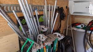 Short lengths of electrical conduit (EMT) in a rack with various hand benders