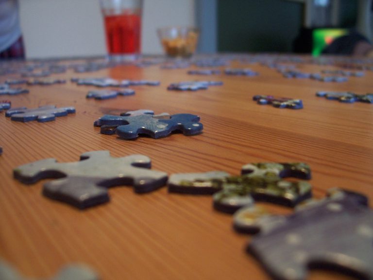 Puzzle pieces on a table.