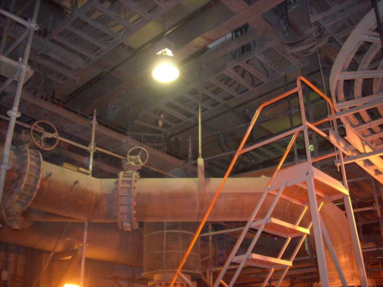 36″ Pipe with access stairs in the lower levels of a copper mine