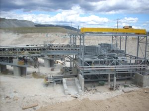Under Construction conveyor belt transfer tower in an open pit mine