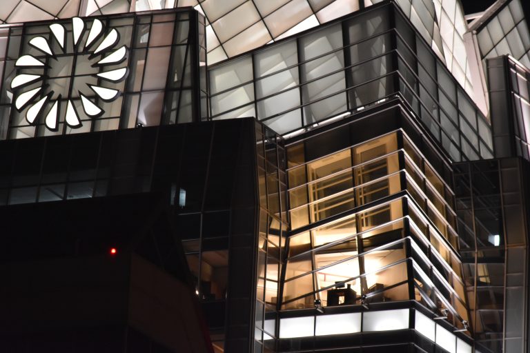 Corner office lit up at night