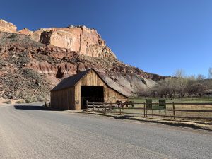 Wild West Barn And Horses Against Mounatins