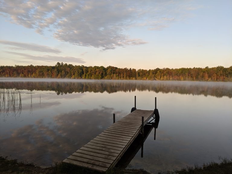 Dock in a small lake in the autumn