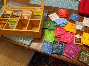 View larger photo: A pile of tea bags and a tea bag box on a table