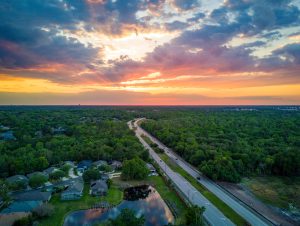 Drone view of sunset over a highway