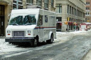 Mail Truck on a snowy NYC street
