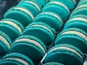 Three rows of teal macarons