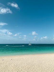 View larger photo: Single sailboat on clear water