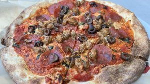 Pepperoni, Sausage, And Black Olive Thin Crust Pizza