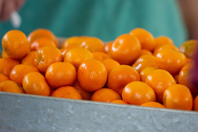 Metal basket filled with oranges