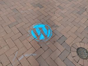 WordPress logo chalked on the ground