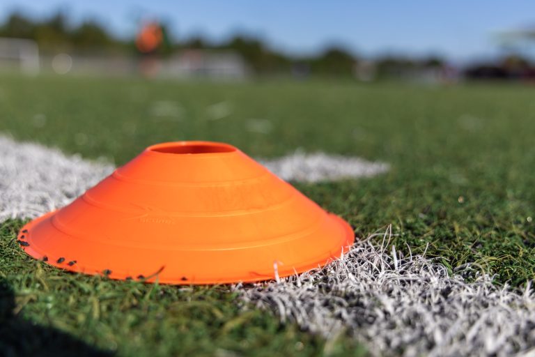 Close-up of a sports cone on a field