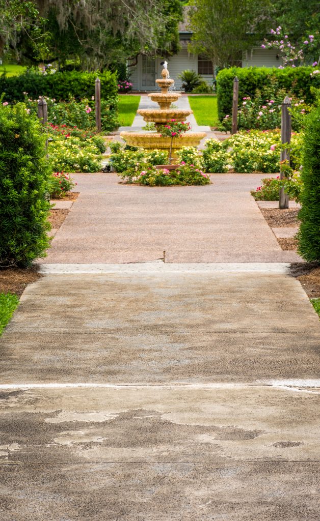 Fountain at the end of a path in a public garden