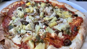 Chicken and artichoke thin crust pizza