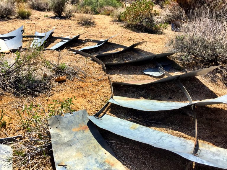 Abandoned Metal Windmill Blades In The Desert