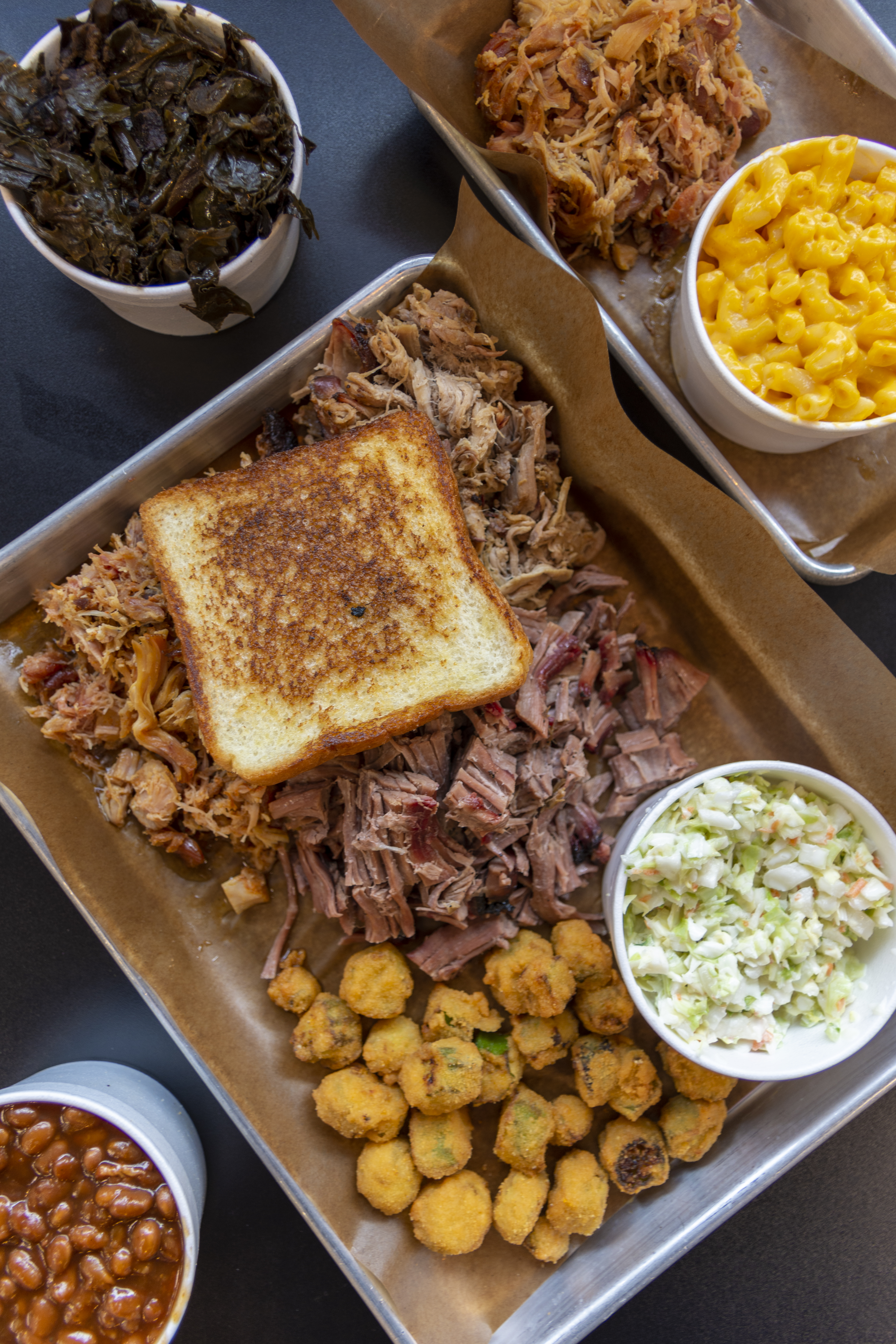 Barbecue brisket, beans, okra, collards, and macaroni and cheese