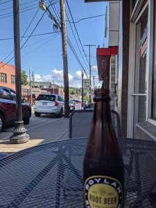 A glass soda pop bottle on a table