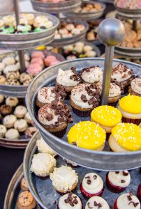 Mini cupcakes stacked on tin racks