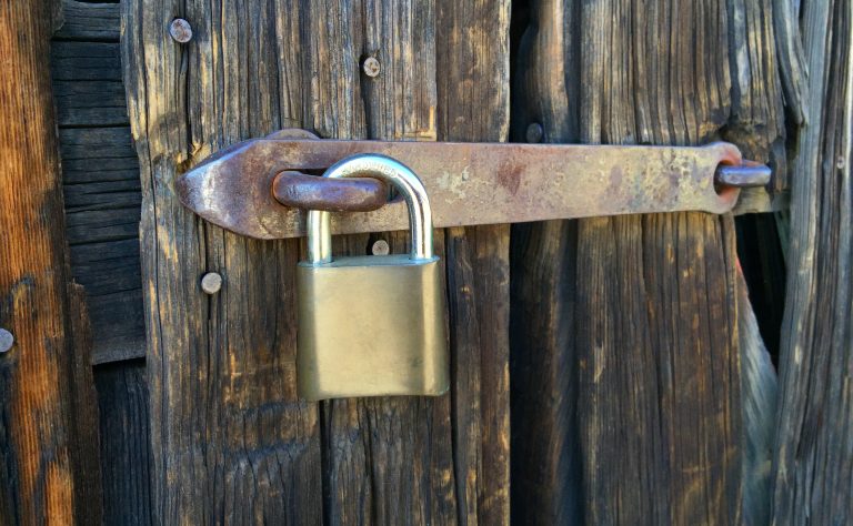 Security Lock On An Old Wood Barn Door