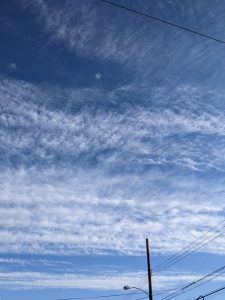 The blue sky, with some clouds