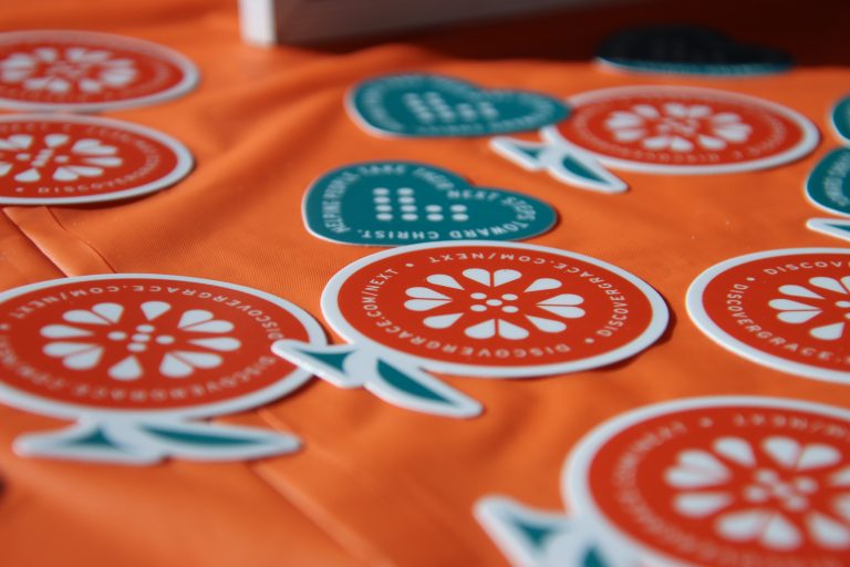 Close-up of orange and heart stickers on a table