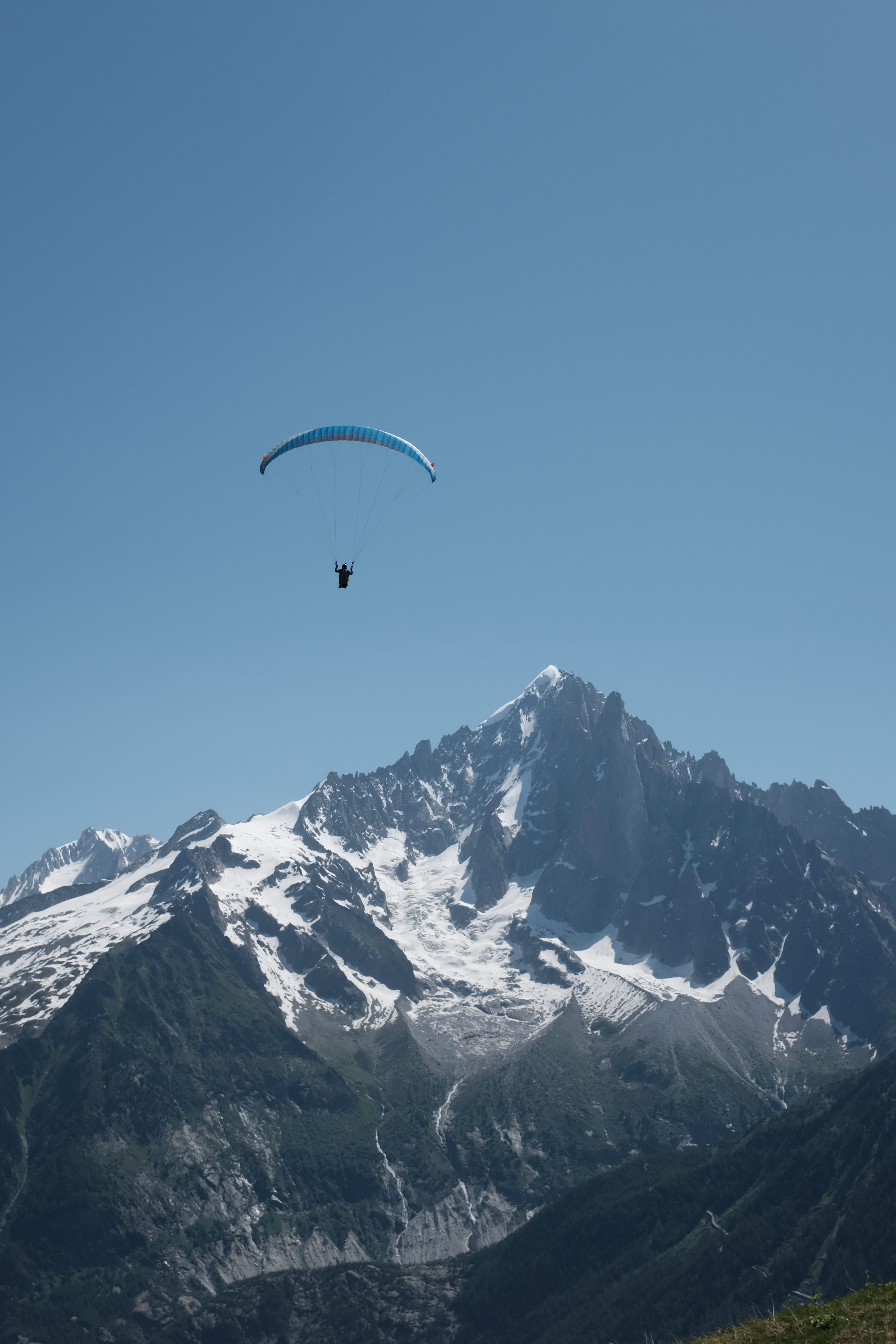 Paragliding over mountains

