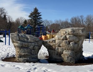 A stone structure in a snow covered public park in Minnesota