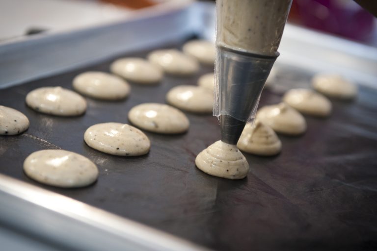 Mounds on a baking tray for making macarons