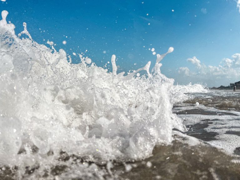 Close-up of wave crashing at the beach