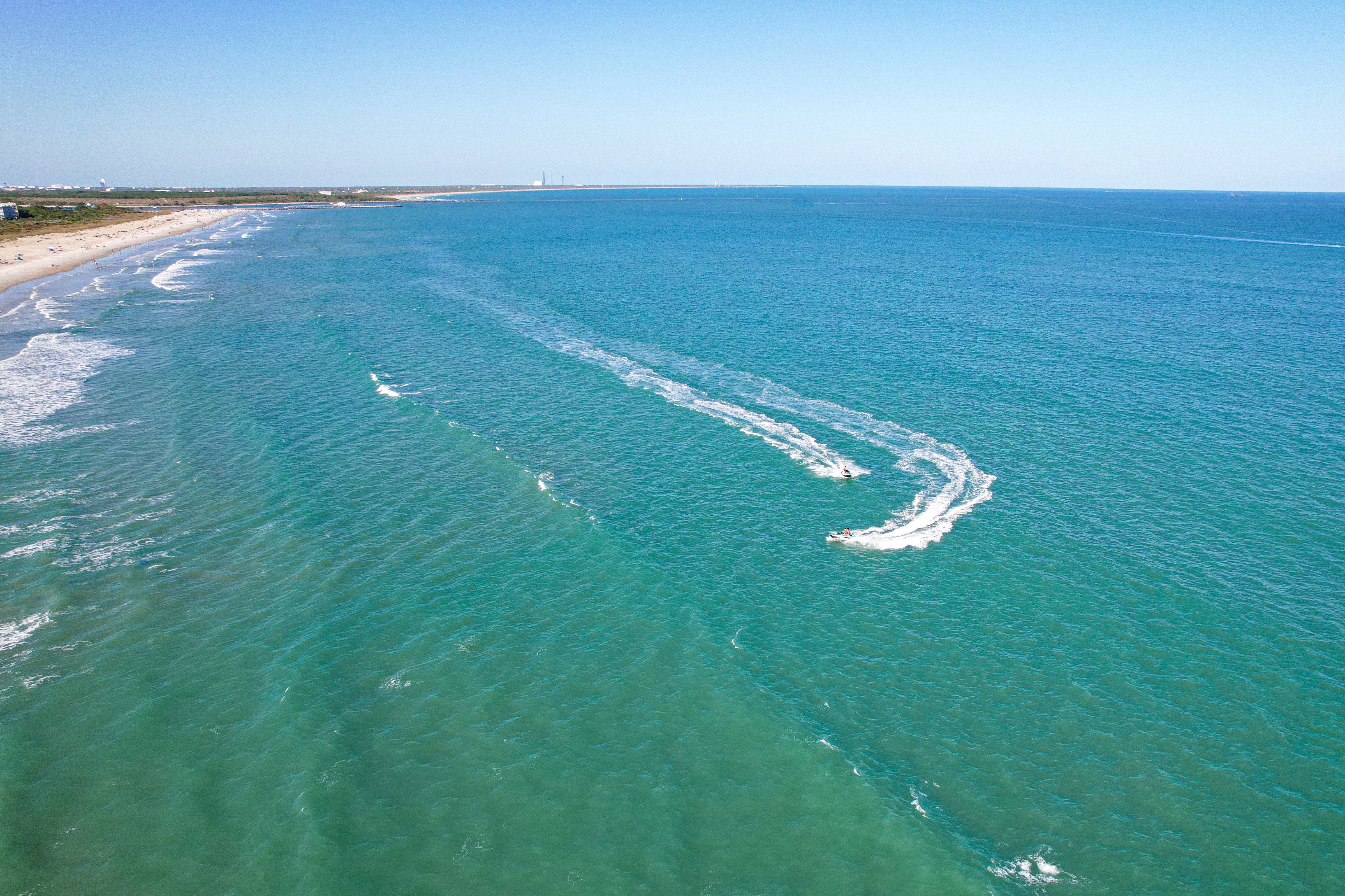 Drone shot of jet skis in the ocean