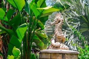 Sea horse sculpture hidden in the trees