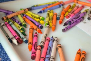 Tray of colorful crayons