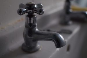 Bathroom sink tap (with bokeh background)
