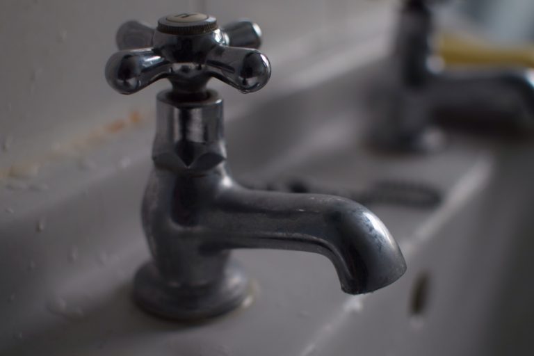 Bathroom sink tap (with bokeh background)