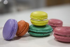 Bunch of colourful macarons on a blurred background