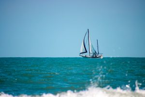 Sailboat out beyond the waves