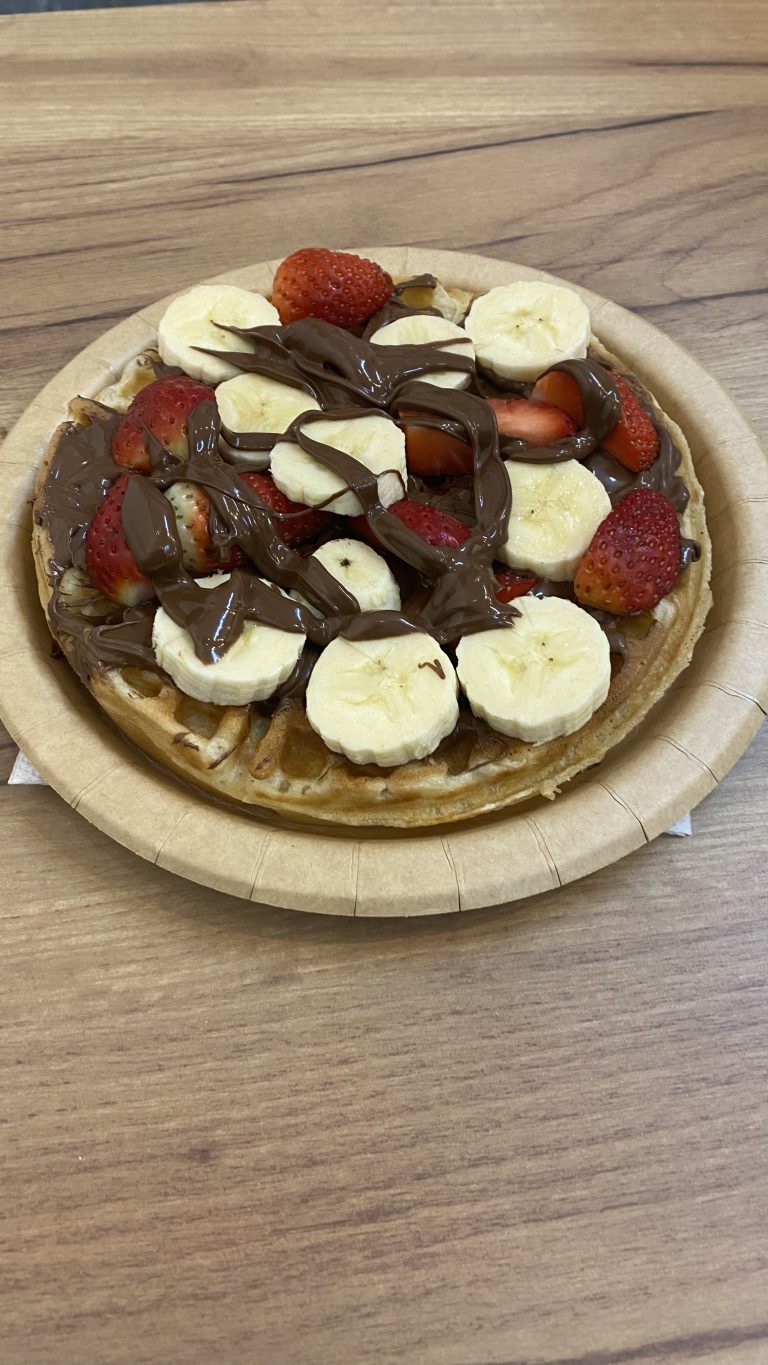 Waffle with strawberry, banana and chocolate