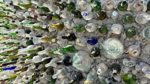 Glass bottles in concrete wall